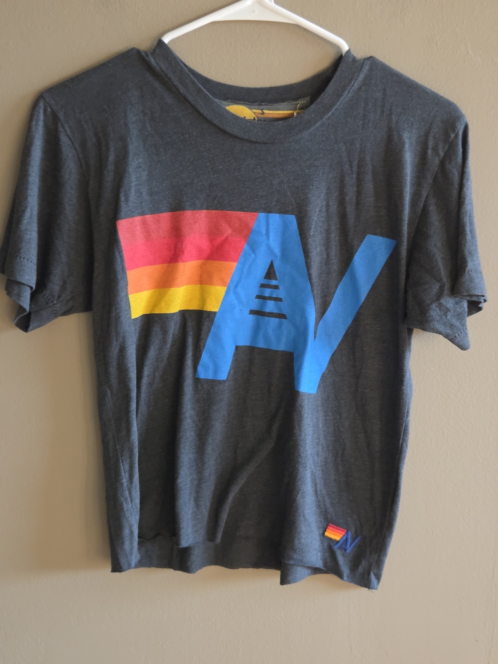 Aviator Nation Charcoal Tee with Blue Logo and Red-Orange-Yellow Stripe